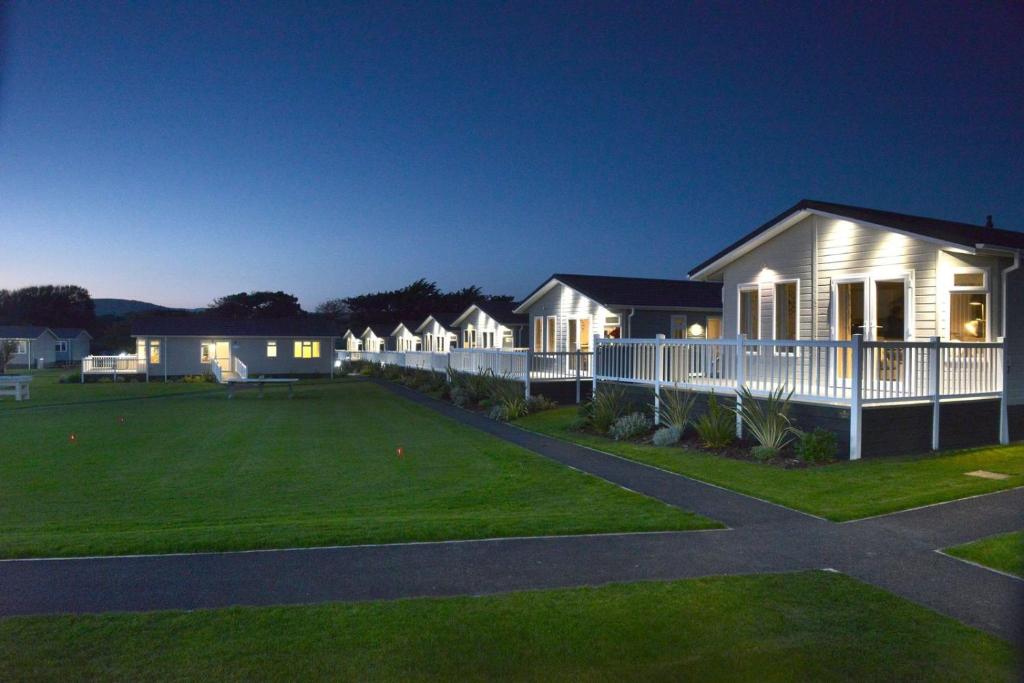 a house with a lawn in front of it at Croyde Bay Hotel or Self Catering in Croyde