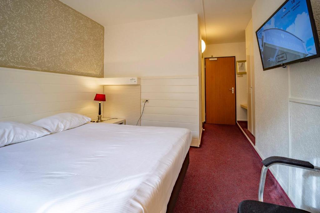 Postel nebo postele na pokoji v ubytování Fletcher Hotel Apeldoorn