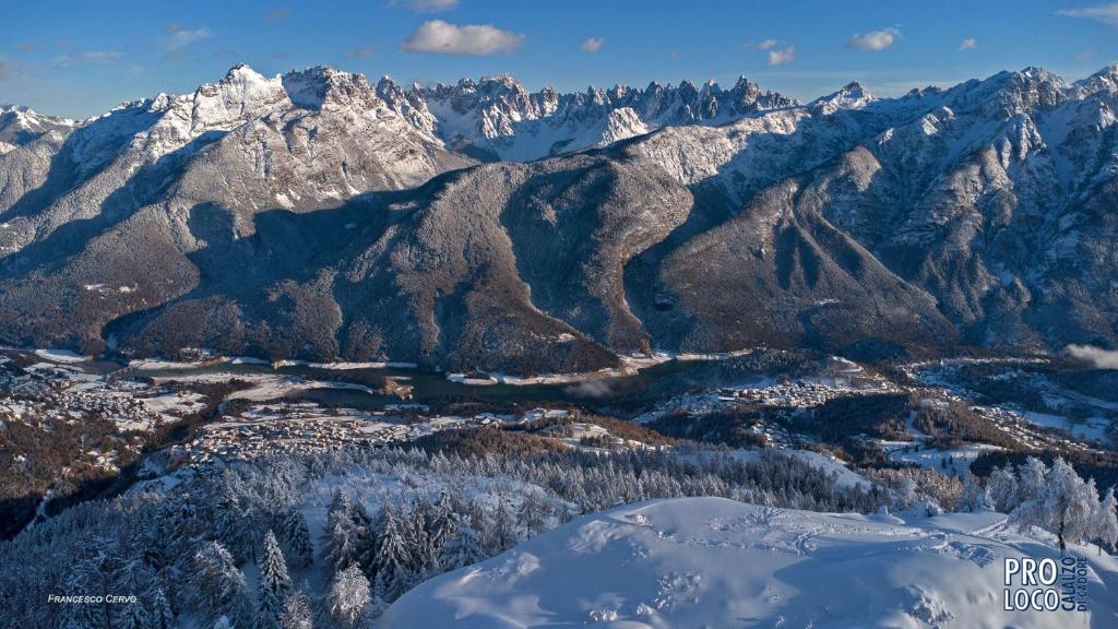 an aerial view of a snowy mountain range at Lunga Via Delle Dolomiti in Calalzo
