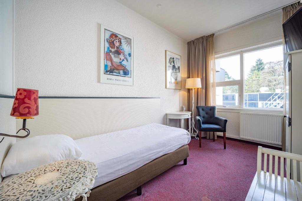 Postel nebo postele na pokoji v ubytování Fletcher Hotel Apeldoorn
