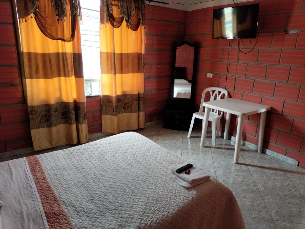 Postel nebo postele na pokoji v ubytování Casa Hotel Los Faroles- Samaná/Caldas
