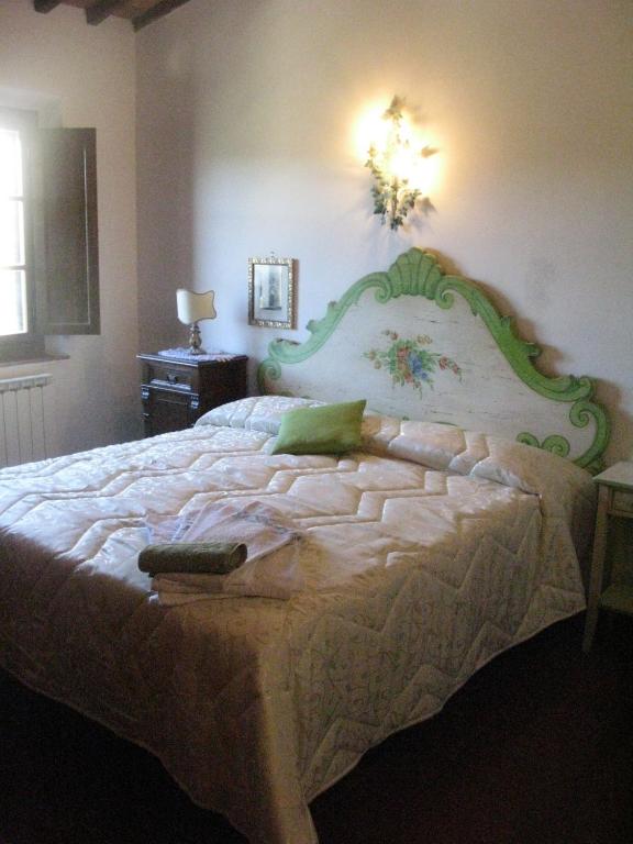 Postel nebo postele na pokoji v ubytování Relais Antico Borgo San Lorenzo