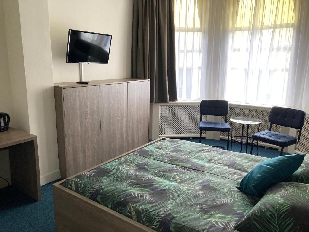 TV a/nebo společenská místnost v ubytování Hotel Poseidon