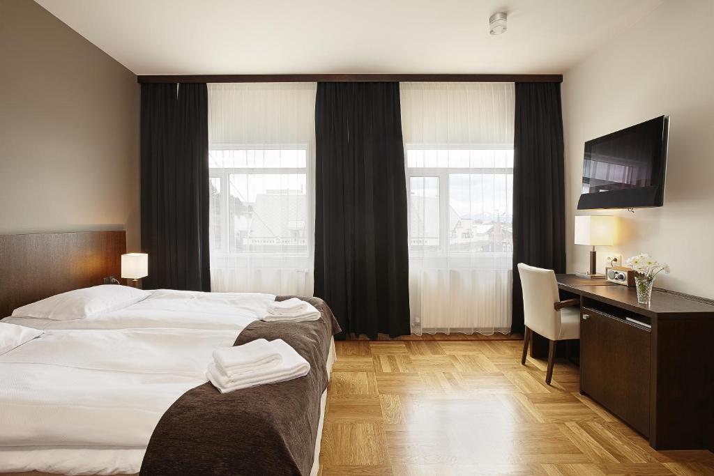 Postel nebo postele na pokoji v ubytování Hotel Kea by Keahotels