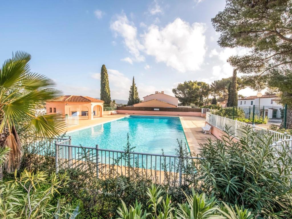 a swimming pool in a yard with a house at Holiday Home Bonporteau-3 by Interhome in Cavalaire-sur-Mer