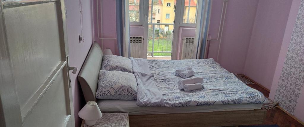 Posteľ alebo postele v izbe v ubytovaní Apartman Slavonija