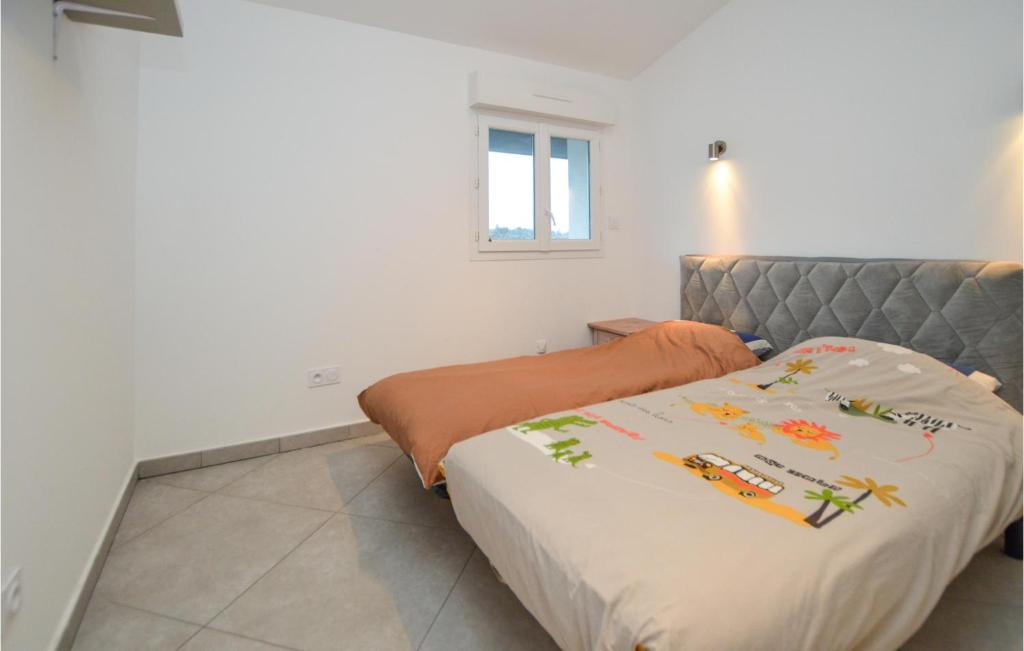 Posteľ alebo postele v izbe v ubytovaní Lovely Apartment In Ghisonaccia