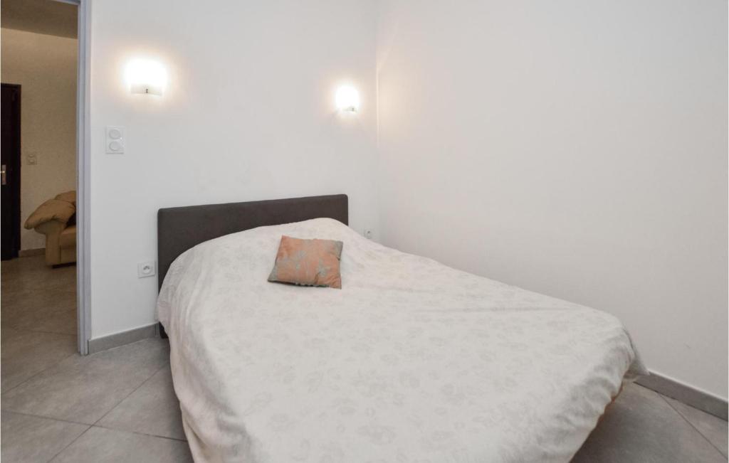 Posteľ alebo postele v izbe v ubytovaní Lovely Apartment In Ghisonaccia