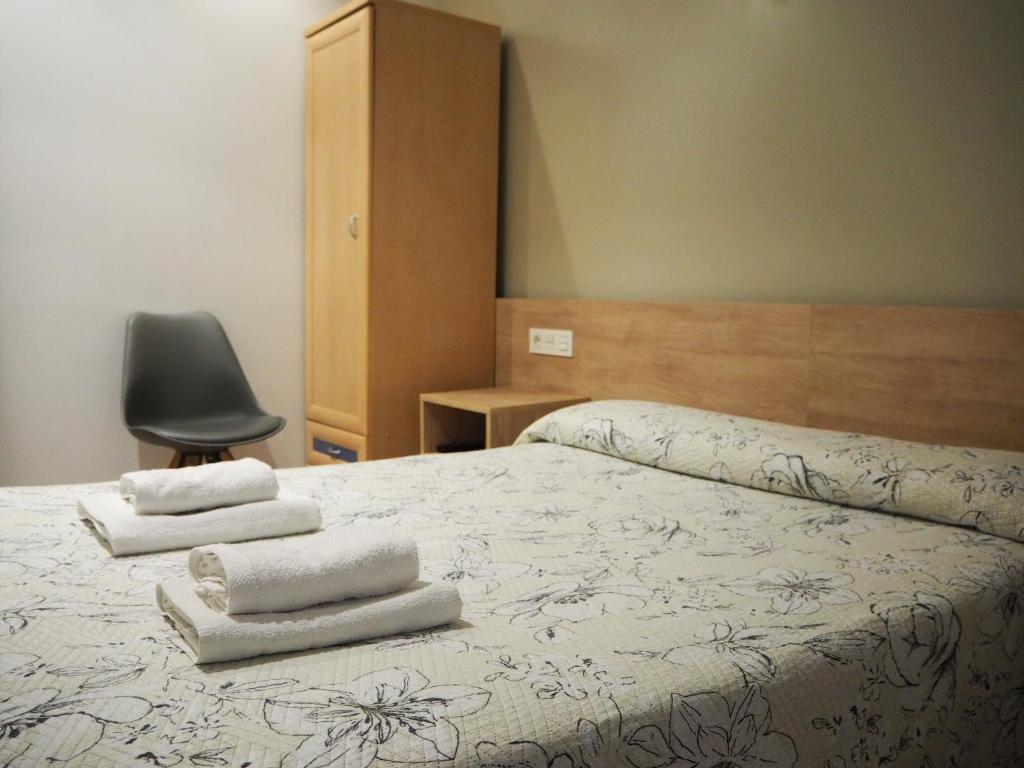 Postel nebo postele na pokoji v ubytování Pensión Acella