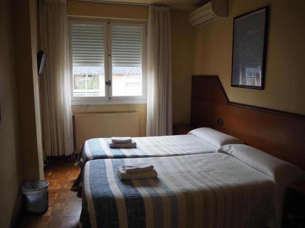 Postel nebo postele na pokoji v ubytování Pensión Acella
