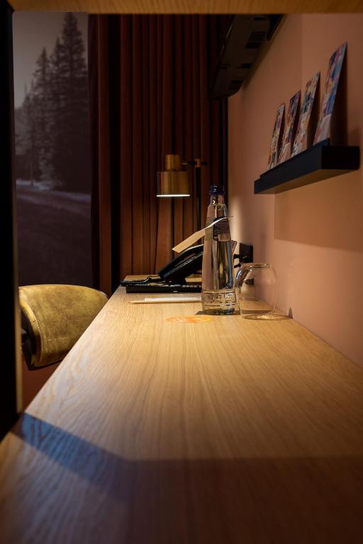 Postel nebo postele na pokoji v ubytování Mah Hotel