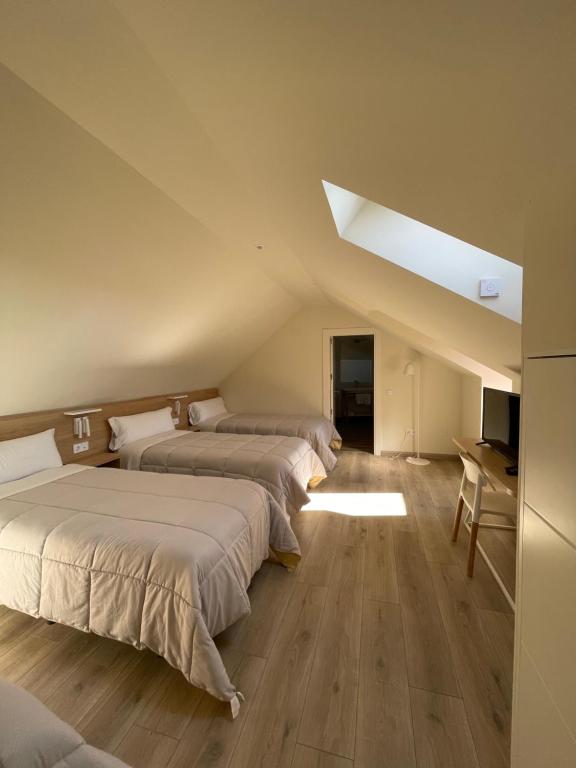 Postel nebo postele na pokoji v ubytování APARTAMENTOS TURÍSTICOS GUIANA