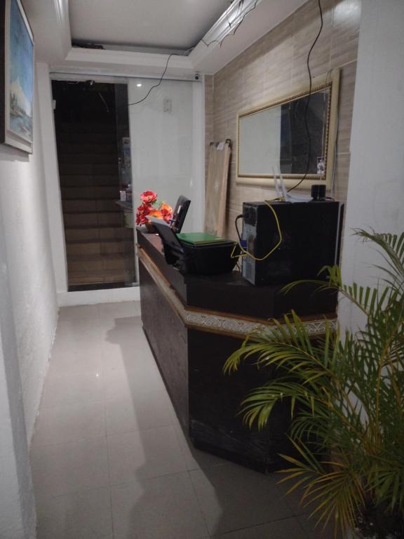 an office with a reception desk with at Pousada Trilha do Pelo in Salvador