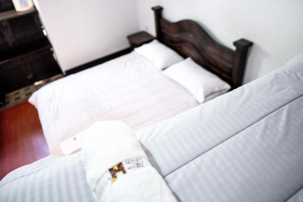 Ένα ή περισσότερα κρεβάτια σε δωμάτιο στο Hotel Casa del Colibri
