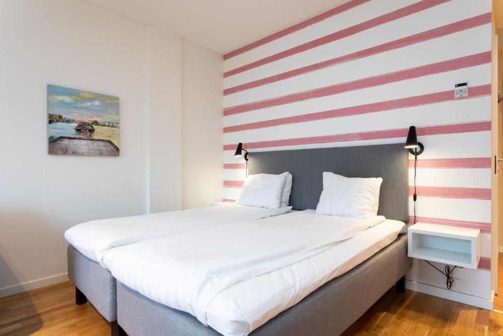Postel nebo postele na pokoji v ubytování ApartDirect Hammarby Sjöstad