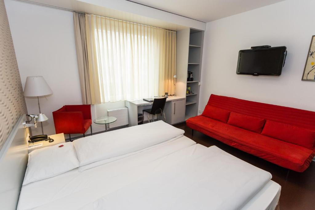 Postel nebo postele na pokoji v ubytování Sorell Hotel Ador