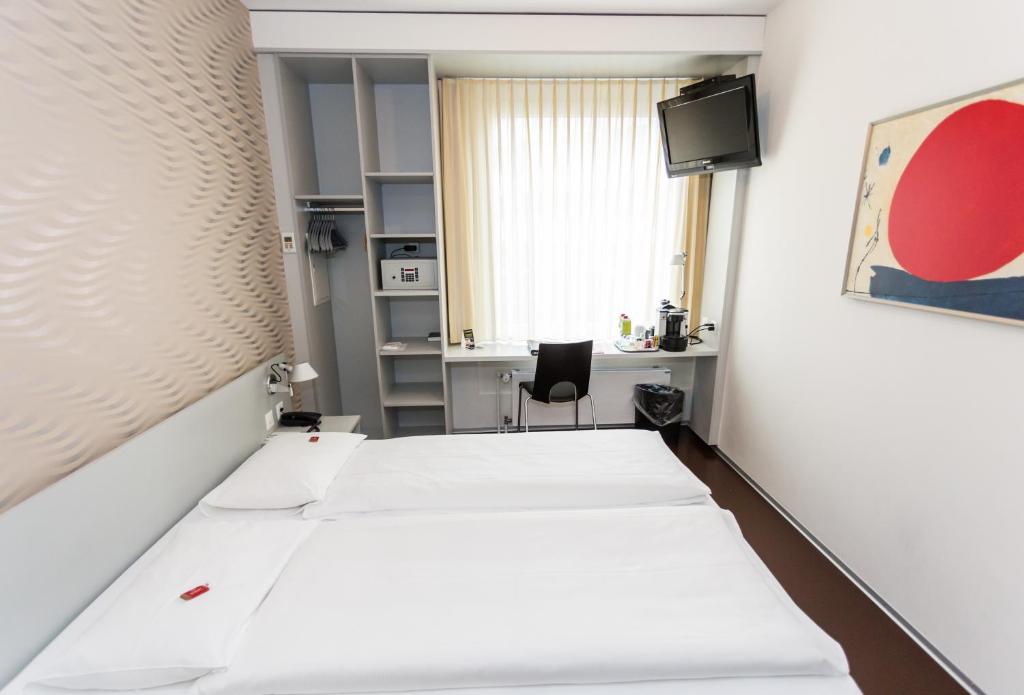 Postel nebo postele na pokoji v ubytování Sorell Hotel Ador