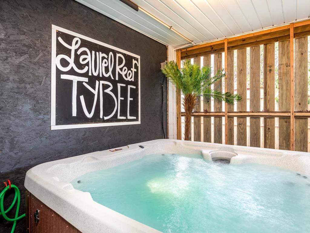 a large bath tub in a room with a large window at Laurel Reef in Tybee Island