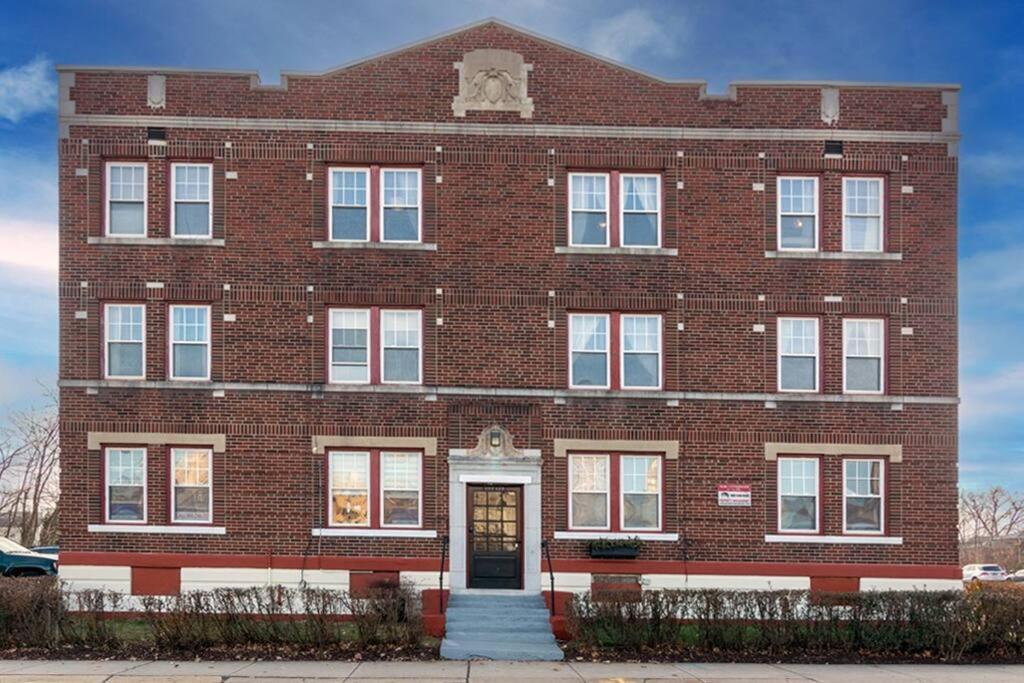 a large red brick building with a door at The Elizabeth Suite B2 in Hartford