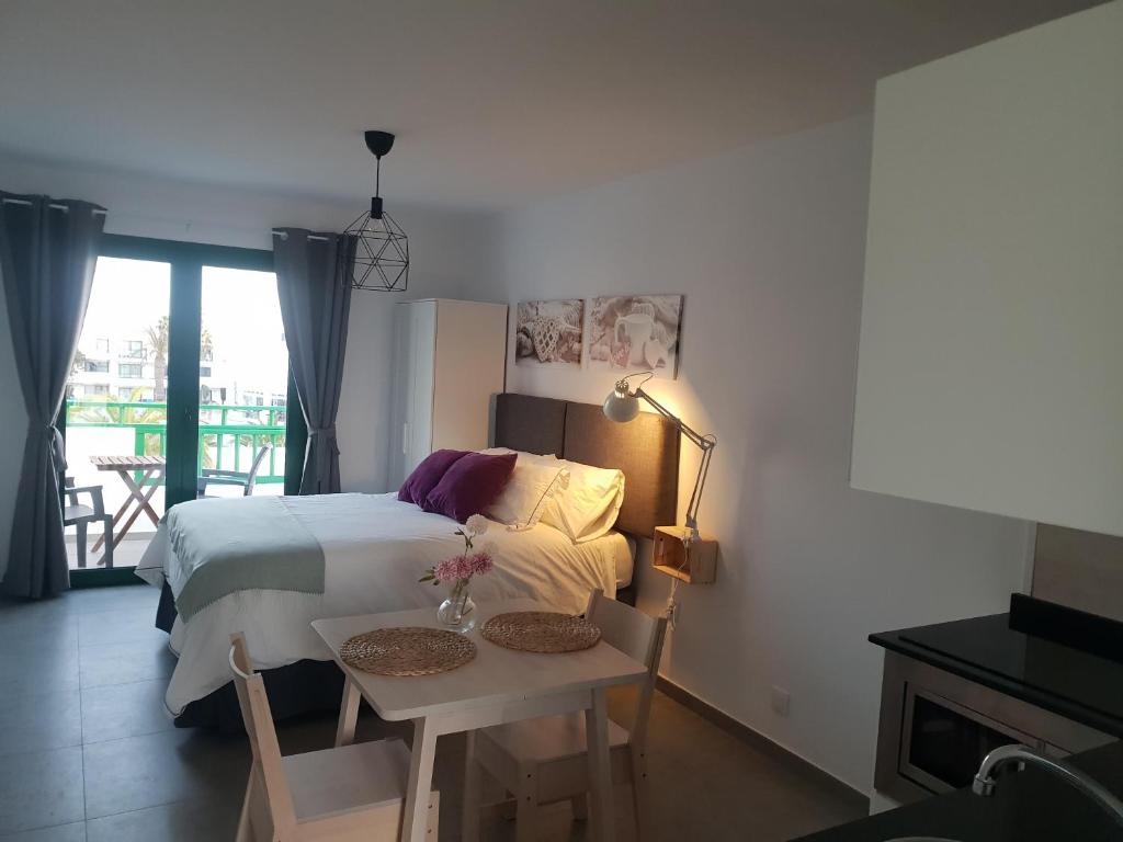Ένα ή περισσότερα κρεβάτια σε δωμάτιο στο Apartamentos Cataira