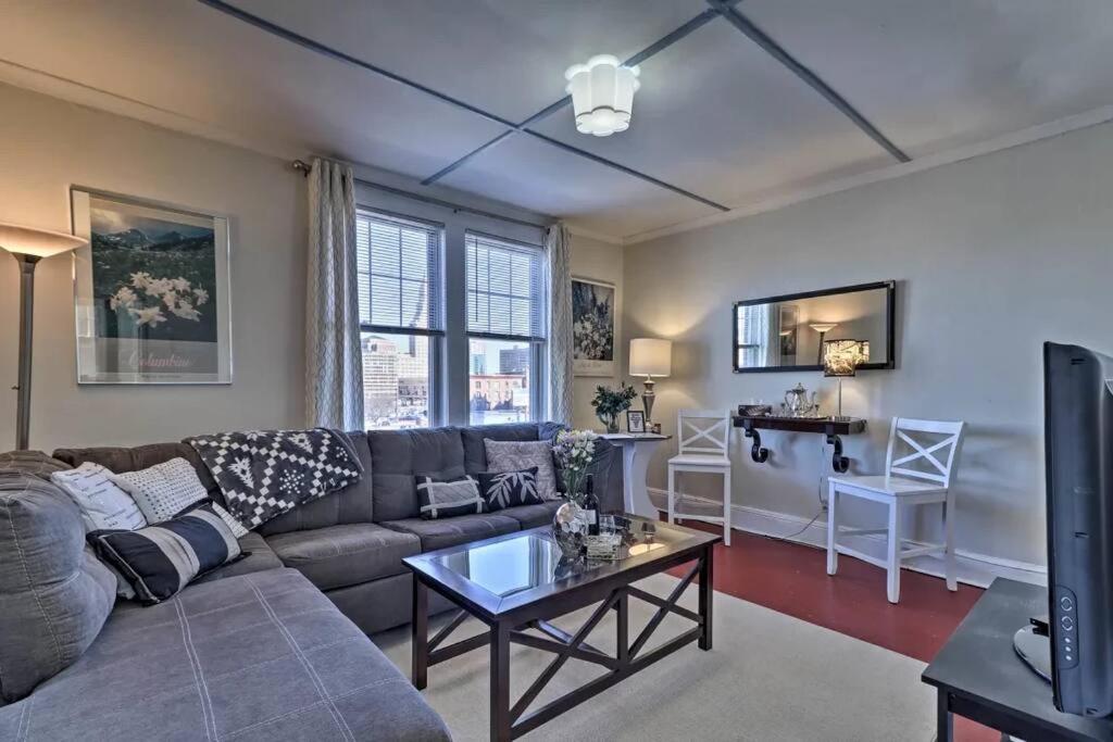 a living room with a couch and a table at The Traveler Suite C1 in Hartford