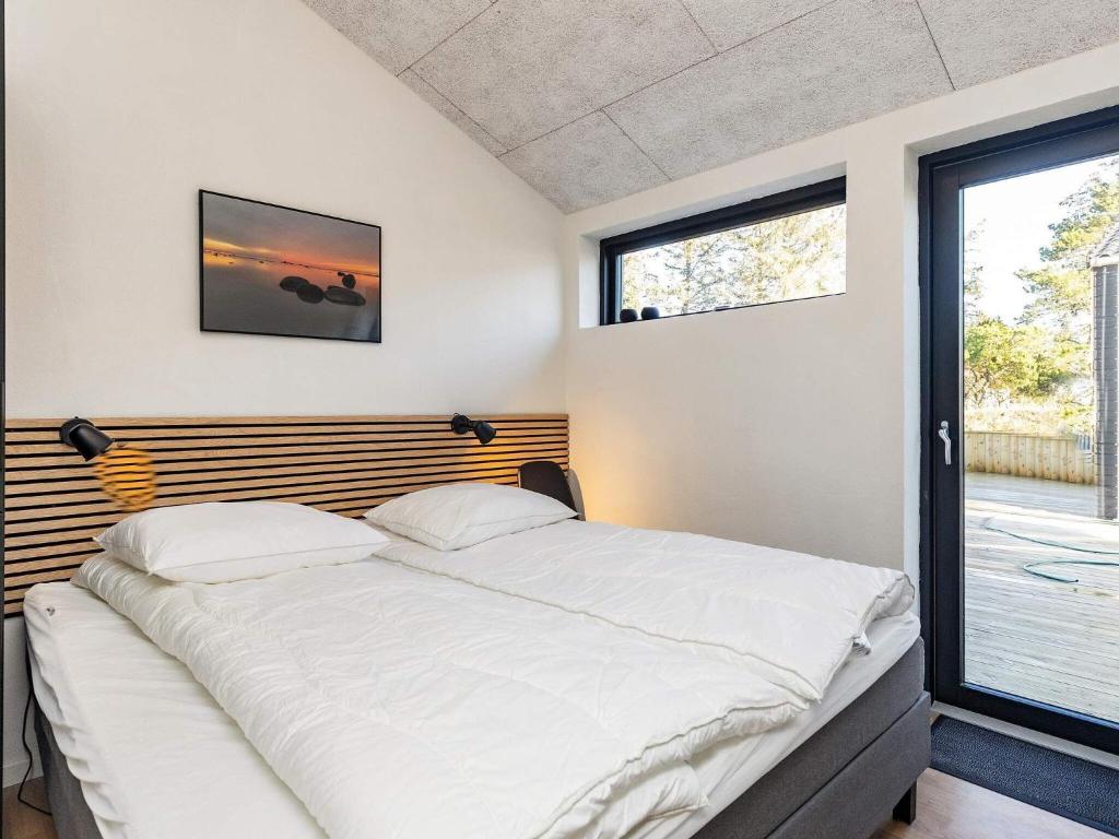 Postel nebo postele na pokoji v ubytování Holiday home Jerup LV