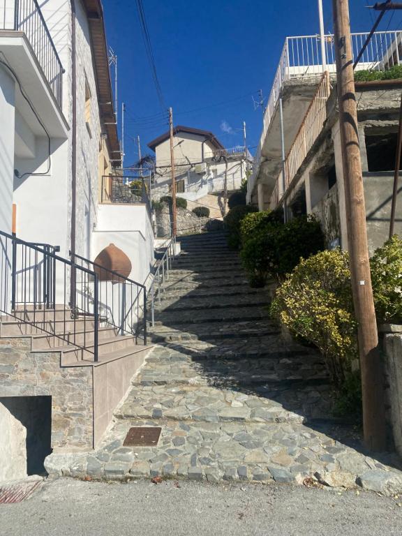 a set of stairs leading up to a building at TheonikosHouse in Agros