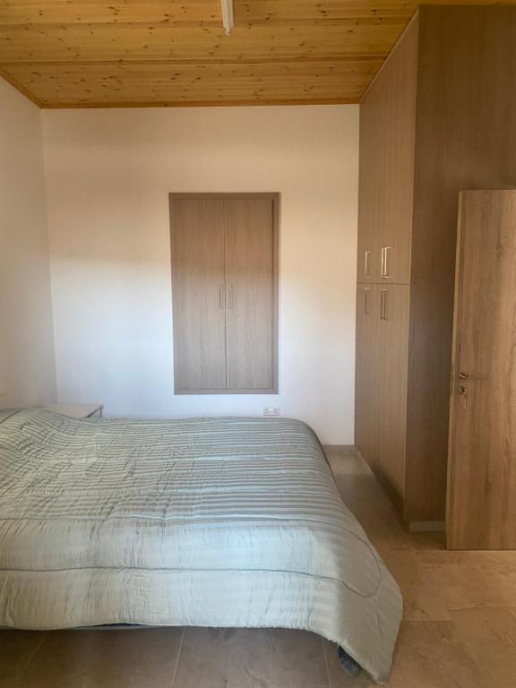 Postel nebo postele na pokoji v ubytování TheonikosHouse