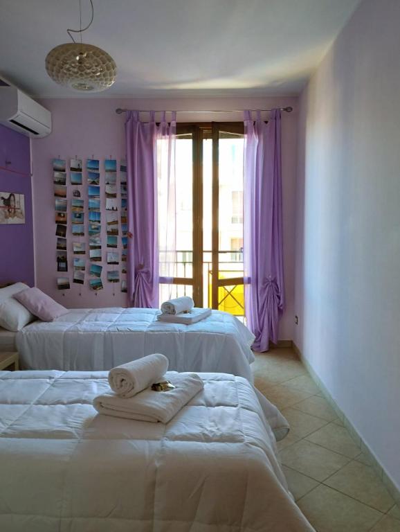 Postel nebo postele na pokoji v ubytování Ferula loft
