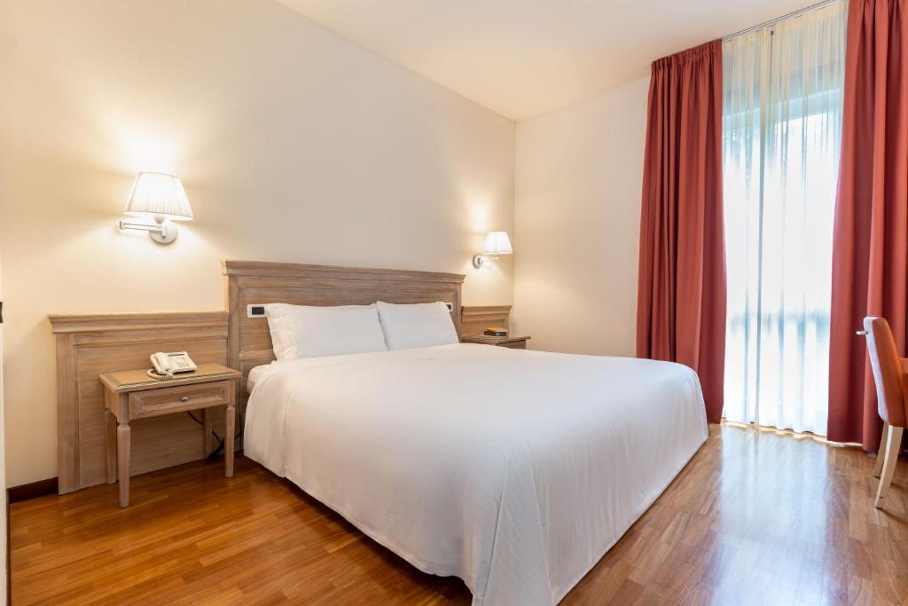 Postel nebo postele na pokoji v ubytování Hotel Alle Acque