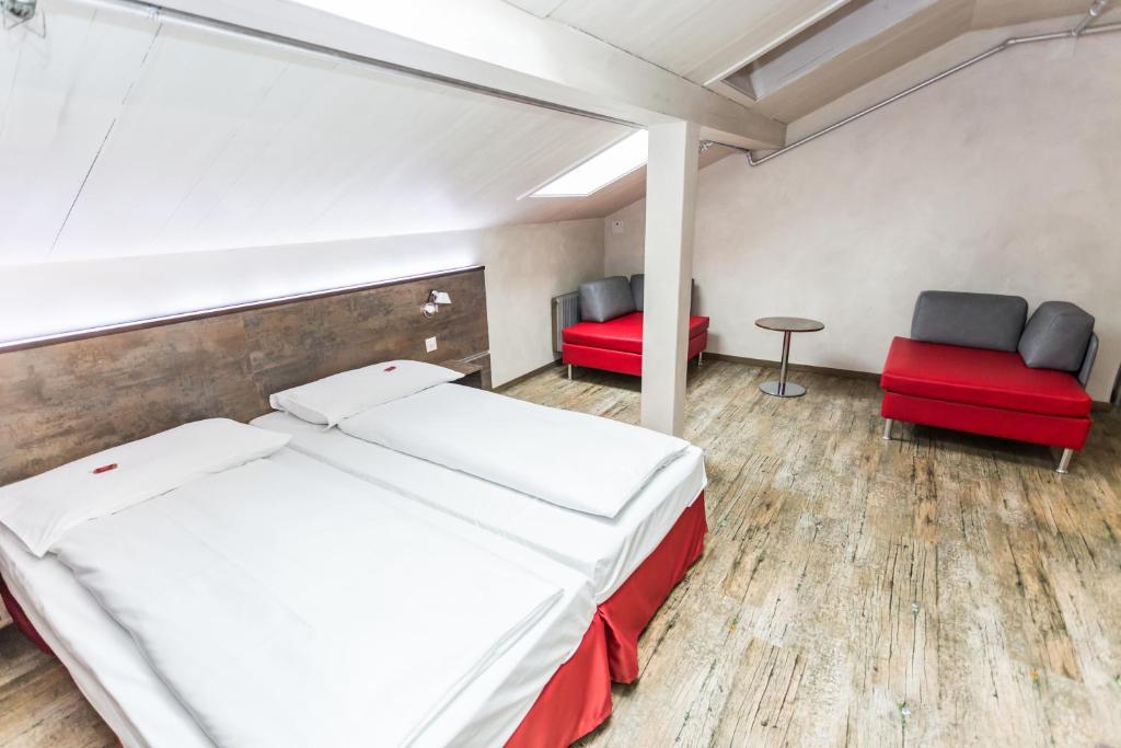 Posteľ alebo postele v izbe v ubytovaní Sorell Hotel Arabelle