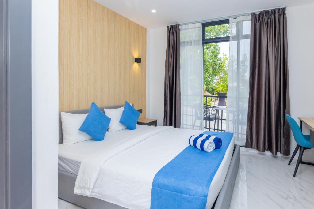Postel nebo postele na pokoji v ubytování Atoll Residence Dhangethi