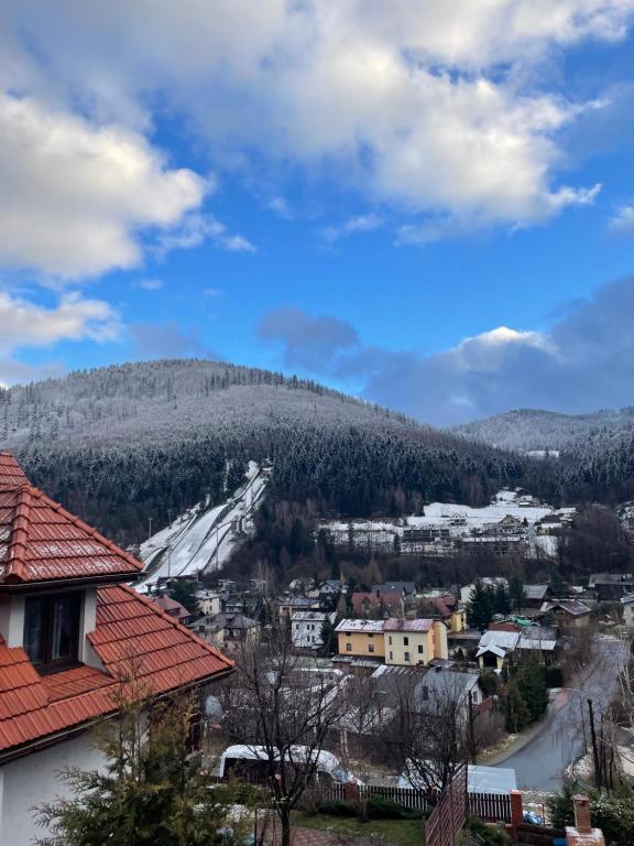 a view of a town with a mountain at Pensjonat Gościniec Szczyrk in Szczyrk