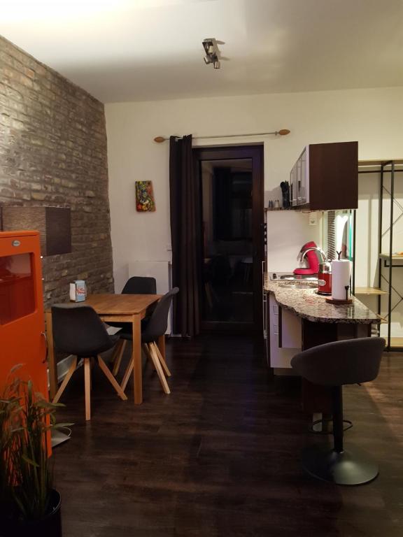 a kitchen and dining room with a table and chairs at Deutzer Freiheit in Cologne