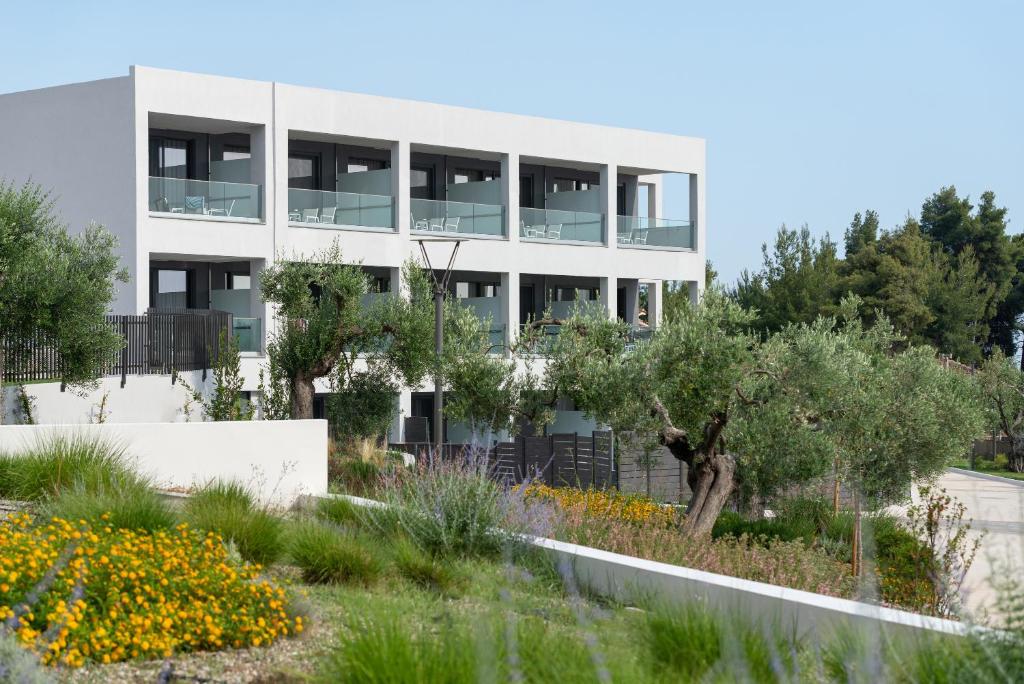 A garden outside Lagomandra Luxury Suites with Private Pools