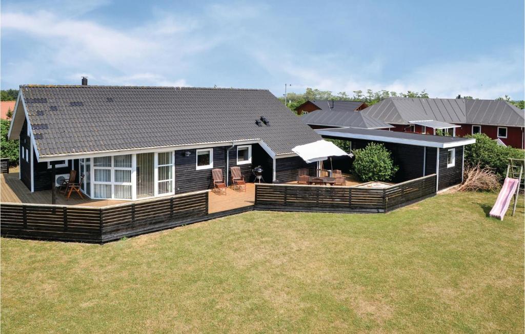 a house with a large yard in front of it at Holiday Home Tranebærvej Tarm Ix in Hemmet