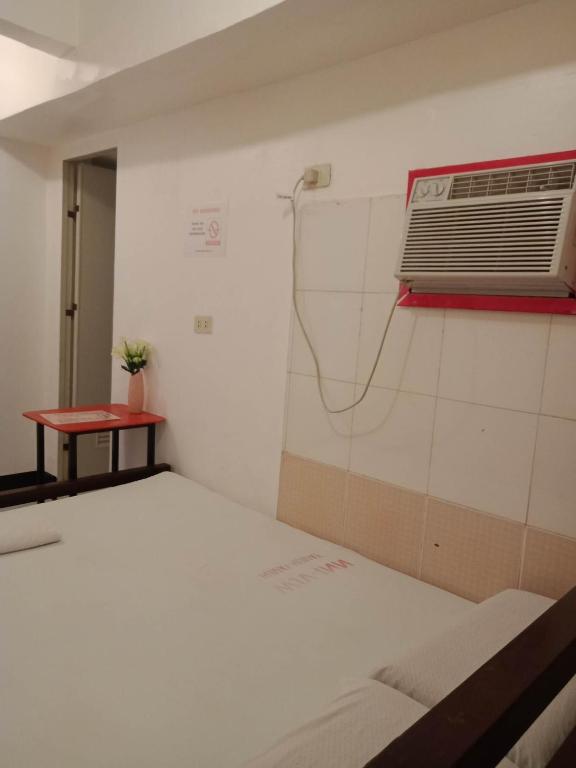 Postel nebo postele na pokoji v ubytování WJV INN Humay-humay