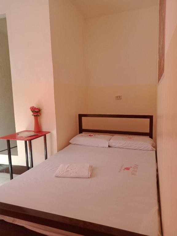 Postel nebo postele na pokoji v ubytování WJV INN Humay-humay