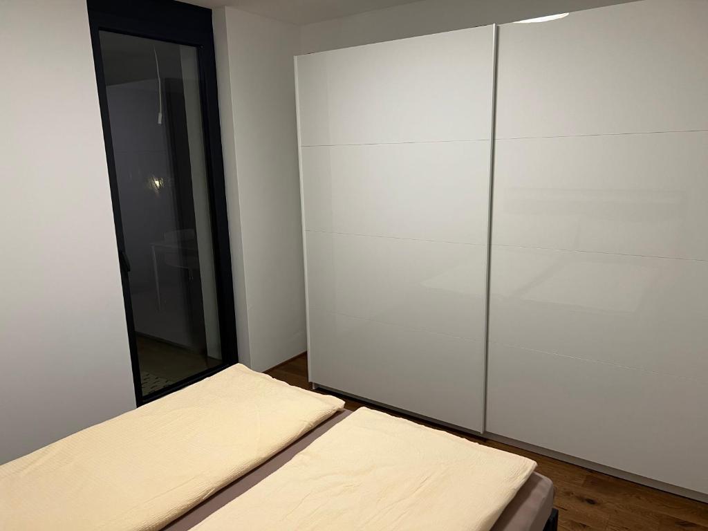 Postel nebo postele na pokoji v ubytování Haus Am Anger Dornbirn