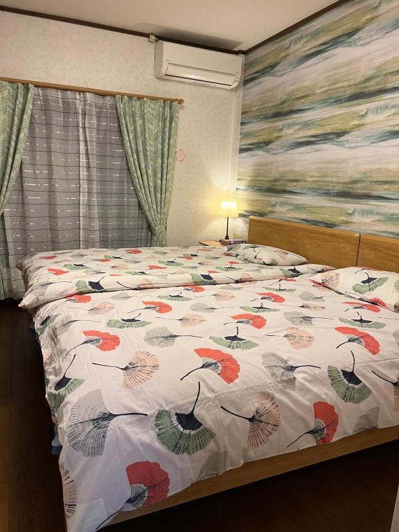 Postel nebo postele na pokoji v ubytování 舟荘
