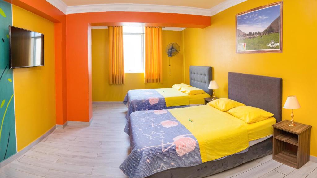 Postel nebo postele na pokoji v ubytování Hotel Savilayo