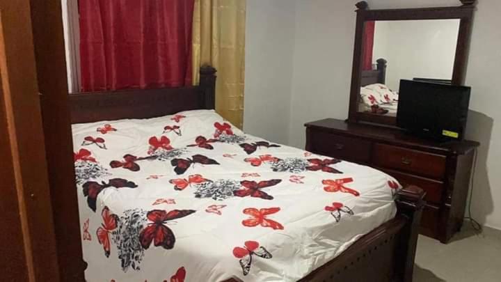 מיטה או מיטות בחדר ב-Villa La Mariposa