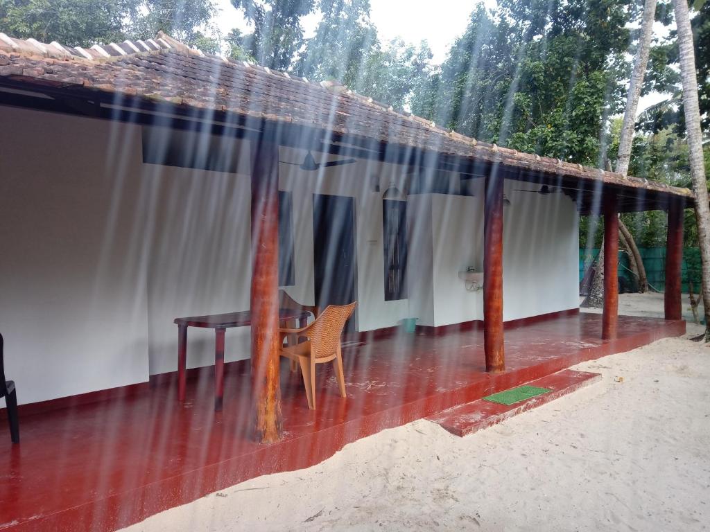 a patio with a table and a tent at Ethus'villahomestay in Mararikulam