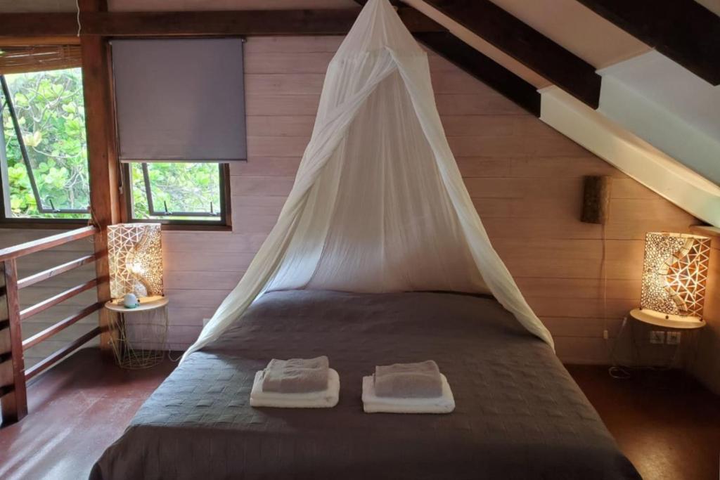 Vuode tai vuoteita majoituspaikassa Cottage Miti Reva