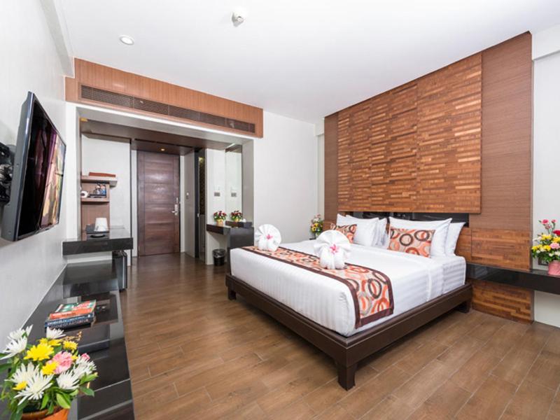 Postel nebo postele na pokoji v ubytování Am Samui Palace