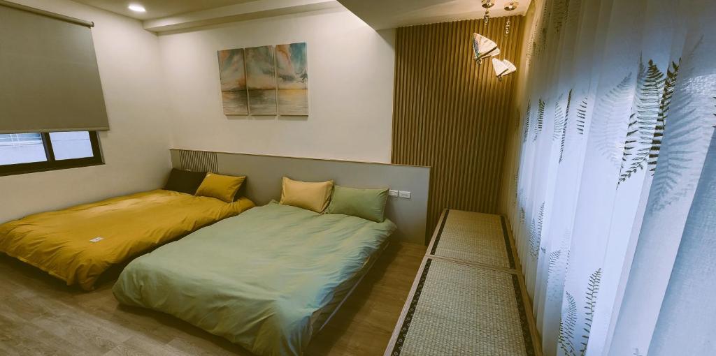 Postel nebo postele na pokoji v ubytování 定春行旅 Haru Guesthouse