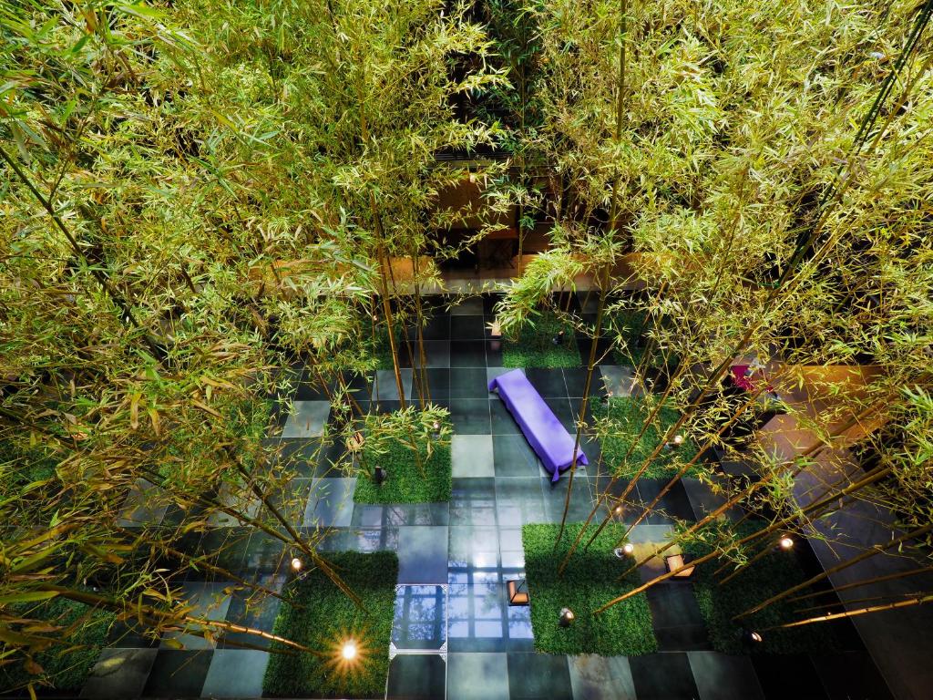an overhead view of a garden with trees and a pool at Dhawa Yura Kyoto - Banyan Group in Kyoto