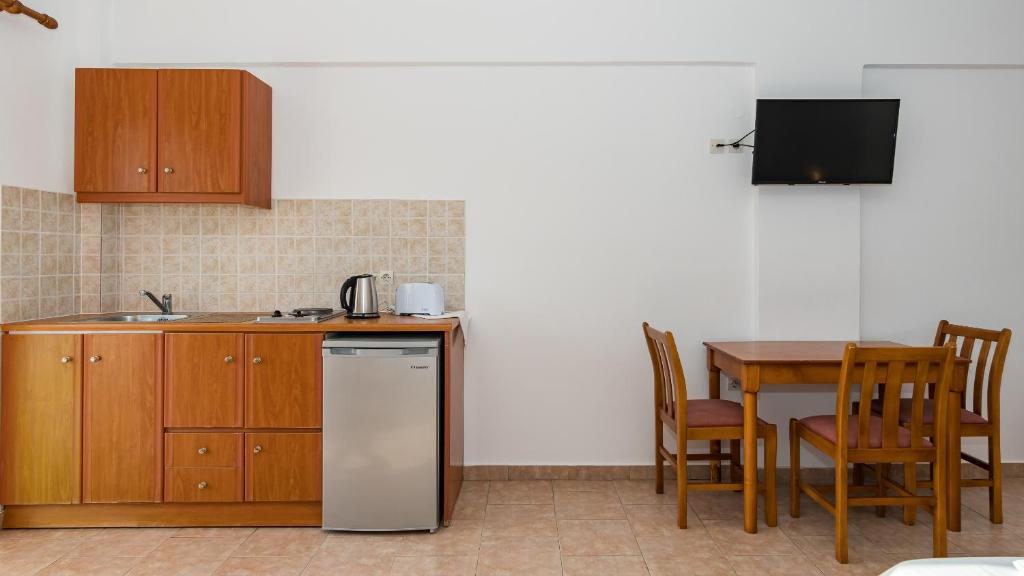 Kuchyň nebo kuchyňský kout v ubytování Goudelis Apartments