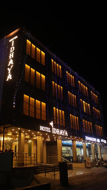 a hotel building with a sign on it at night at HOTEL IDHAYA in Port Blair