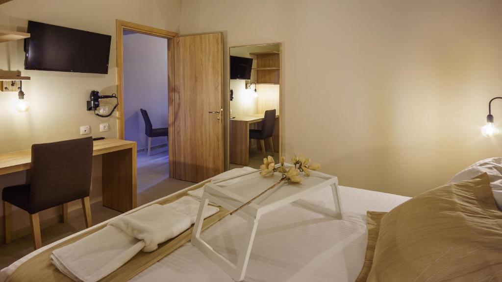 Postel nebo postele na pokoji v ubytování Goudelis Apartments